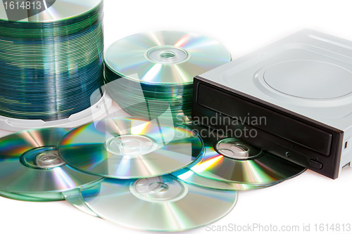 Image of compact discs and burner on a white background 