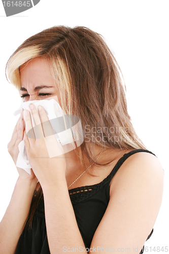 Image of Closeup of gorgeous caucasian woman with cold sneezing into tiss