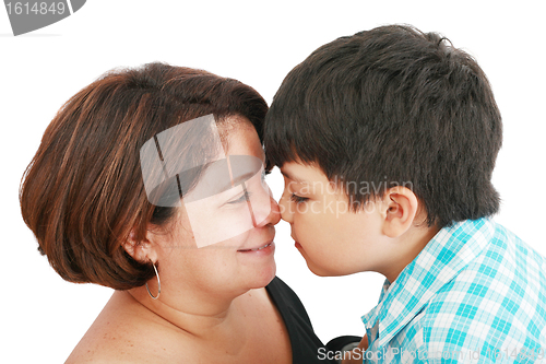 Image of mother and son about to kiss - isolated over white 