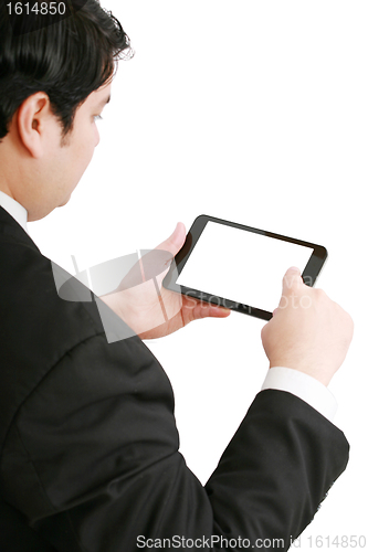 Image of Businessman holding a blank touchpad pc, one finger touches the 