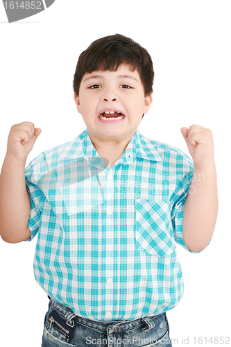 Image of Portrait of a eigth year old boy clenching his fists and screami