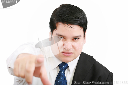 Image of Portrait of an angry young business man in suit pointing at you 