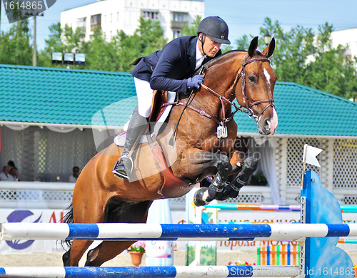 Image of Rider on show jump horse