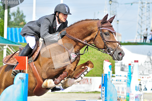 Image of Rider on show jump horse