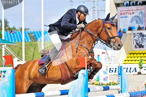 Image of Rider on show jump horse