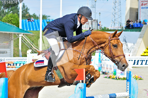 Image of Rider on show jump horse