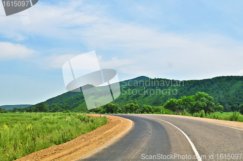 Image of Country road clouds and hill 'sopka'