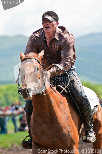 Image of unknown ?ossacks on horse the finish line