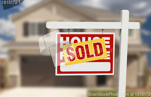 Image of Sold Home For Sale Sign in Front of New House 