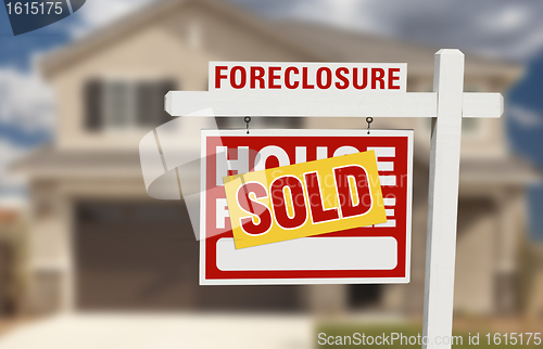 Image of Sold Foreclosure Home For Sale Sign and House