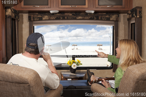 Image of Couple Enjoy Beach View From RV