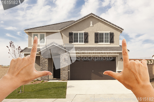 Image of Female Hands Framing Beautiful House