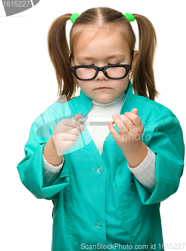 Image of Cute little girl is playing doctor