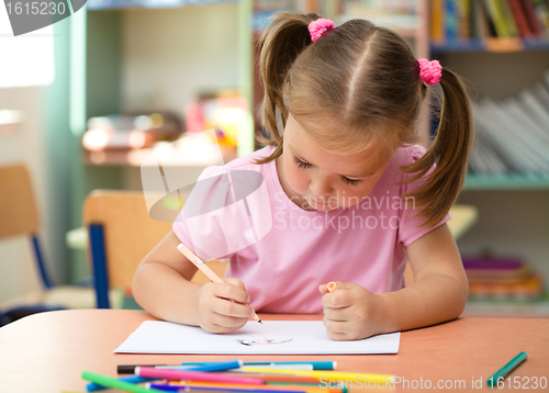 Image of Cute little girl is drawing with felt-tip pen