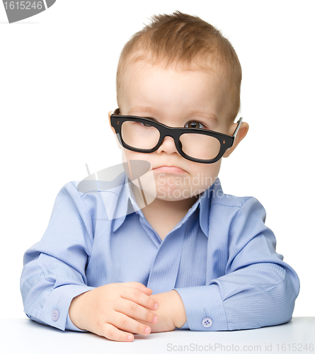 Image of Cute little boy wearing glasses