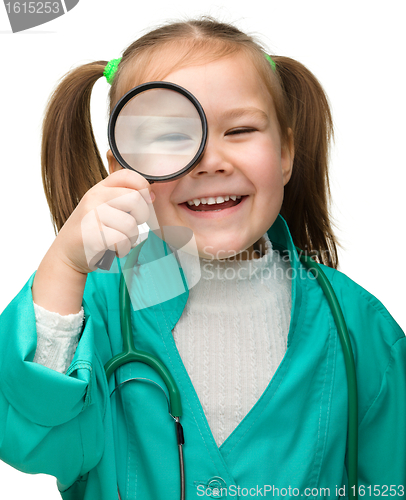 Image of Little girl is playing doctor