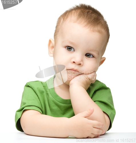 Image of Portrait of a cute and pensive little boy