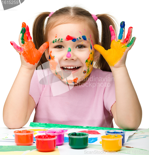 Image of Portrait of a cute girl with painted hands