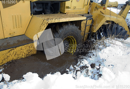 Image of Tractor stuck in the mud