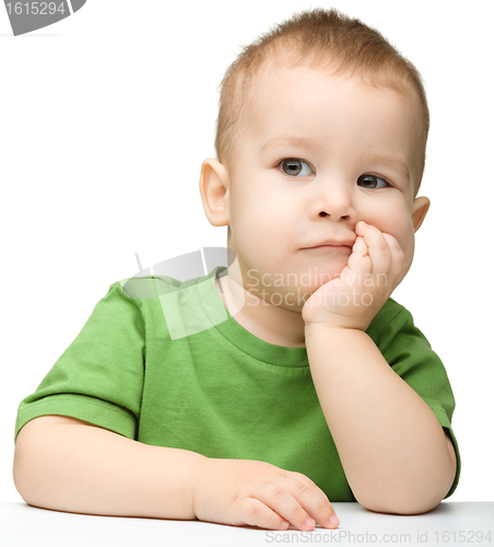 Image of Portrait of a cute and pensive little boy