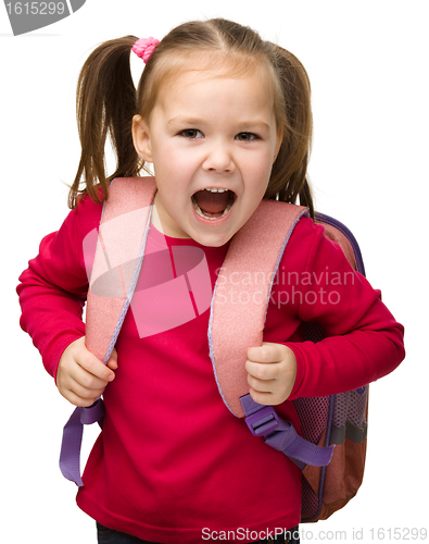 Image of Portrait of a cute schoolgirl with backpack