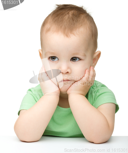 Image of Portrait of a cute and pensive little boy