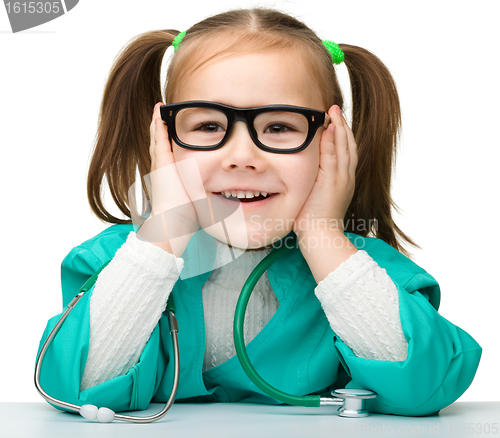 Image of Little girl is playing doctor with stethoscope