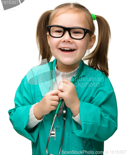 Image of Cute little girl is playing doctor