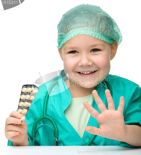 Image of Cute little girl is playing doctor