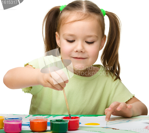 Image of Cute cheerful child play with paints