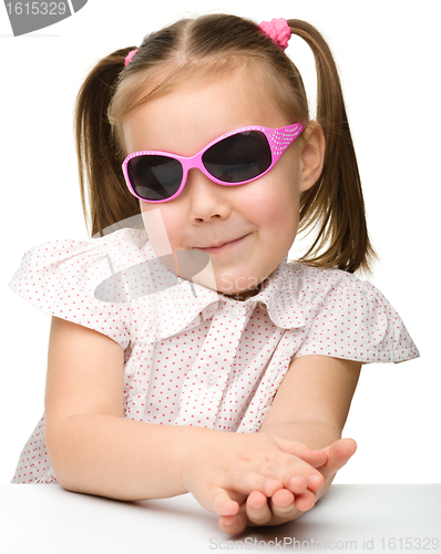 Image of Little girl wearing sunglasses