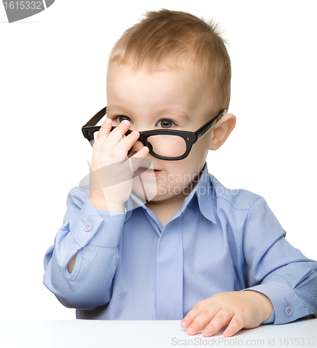 Image of Portrait of a cute little boy wearing glasses