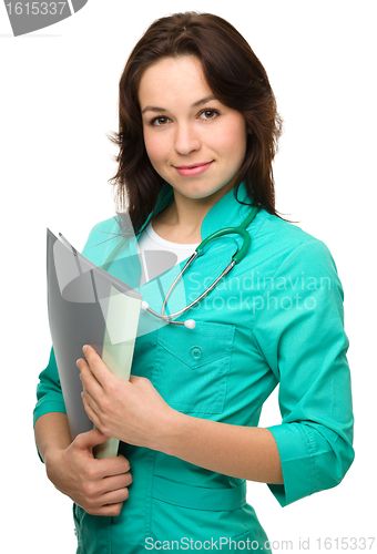 Image of Portrait of a happy young woman doctor