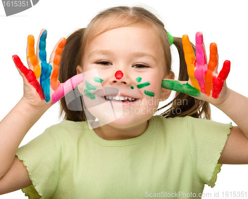 Image of Portrait of a cute girl with painted hands