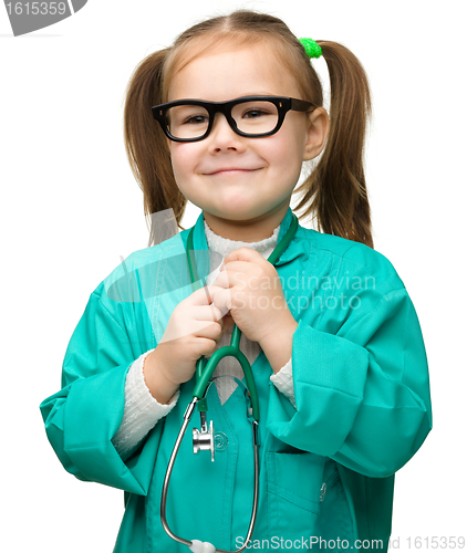 Image of Cute little girl is playing doctor