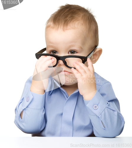 Image of Portrait of a cute little boy wearing glasses