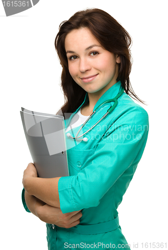 Image of Portrait of a happy young woman doctor