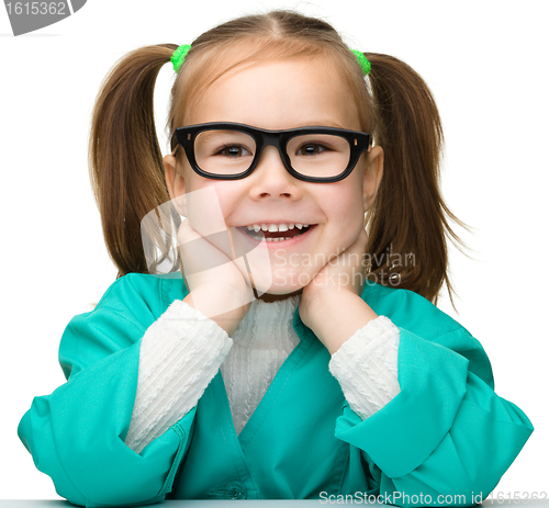 Image of Cute little girl is playing doctor