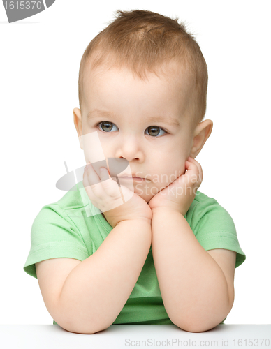 Image of Portrait of a cute and pensive little boy