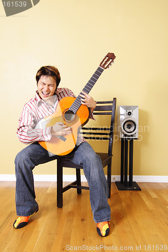 Image of Young guitar player