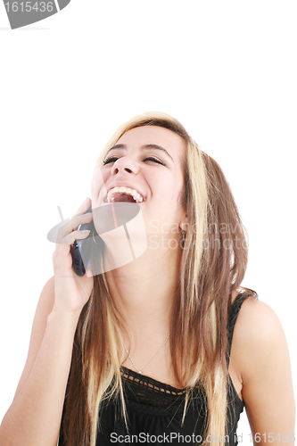 Image of Young beautiful woman bursting out laughing on cellphone. 