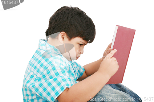 Image of Young boy tries to do his homework 