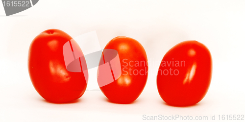 Image of Three tomatoes isolated against white background 