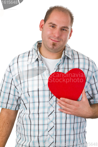 Image of Young man holding red heart