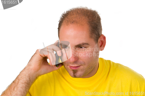 Image of Young man talking on a cell phone