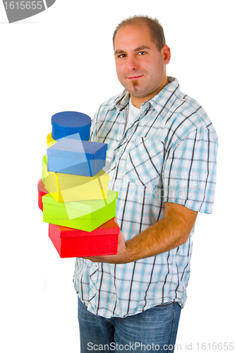 Image of Young man with gift boxes 