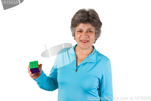 Image of Smiling female senior holding a cube