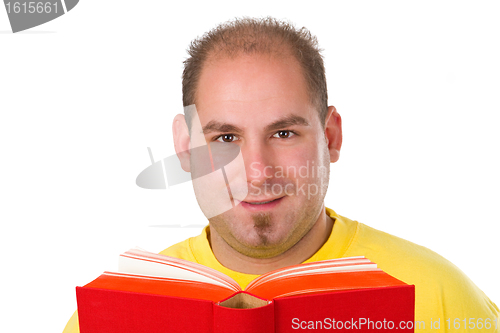 Image of Young man reading a book