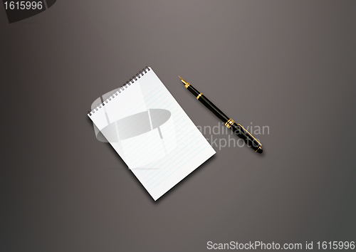 Image of a pen and blank paper on the table 