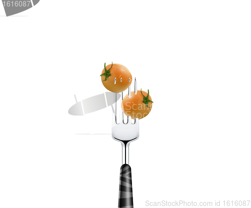 Image of Tomato pierced by fork,  isolated on white background 